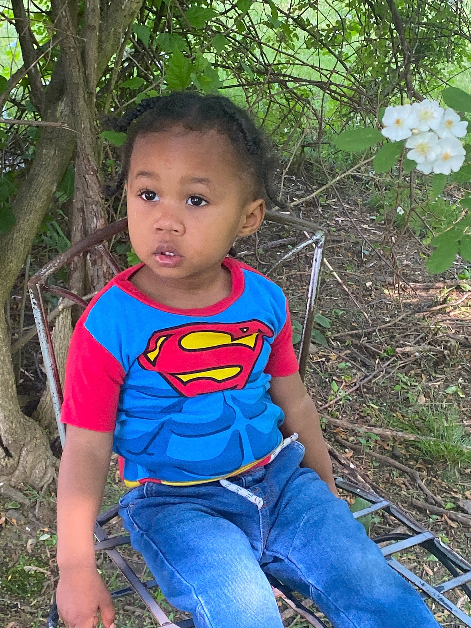 Romello joined the competition — help win amazing prizes! baby_toddler_clothing, botany, child, clothing, electric_blue, flower, grass, happy, iris, leaf, leisure, people_in_nature, person, petal, plant, recreation, sitting, t_shirt, terrestrial_plant, toddler