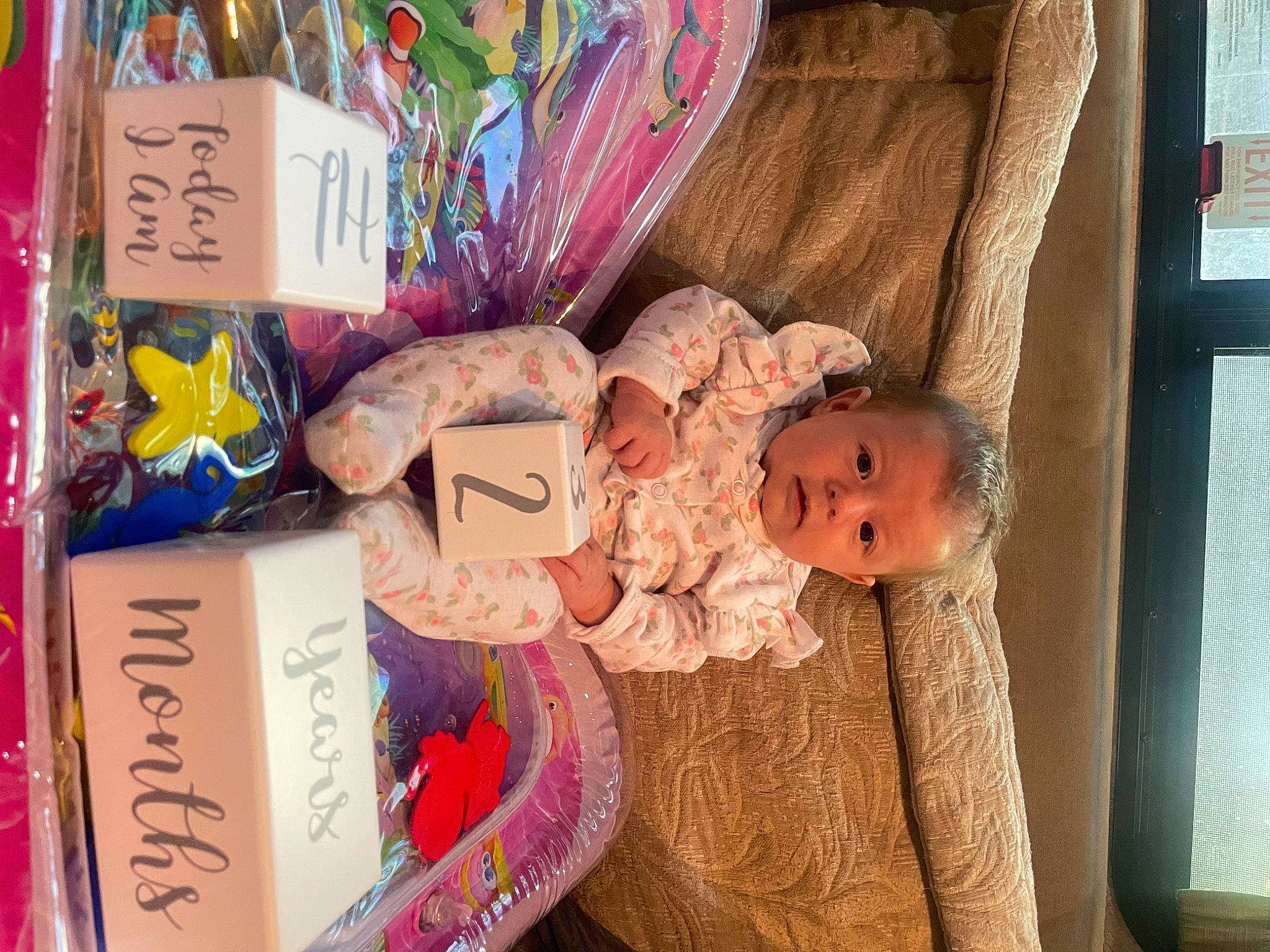 Annalise is registered to the contest to win money with this photo: art, baby, baby_products, baby_toddler_clothing, child, event, happy, paper_product, people, person, product, publication, room, textile, toddler, toy, wood