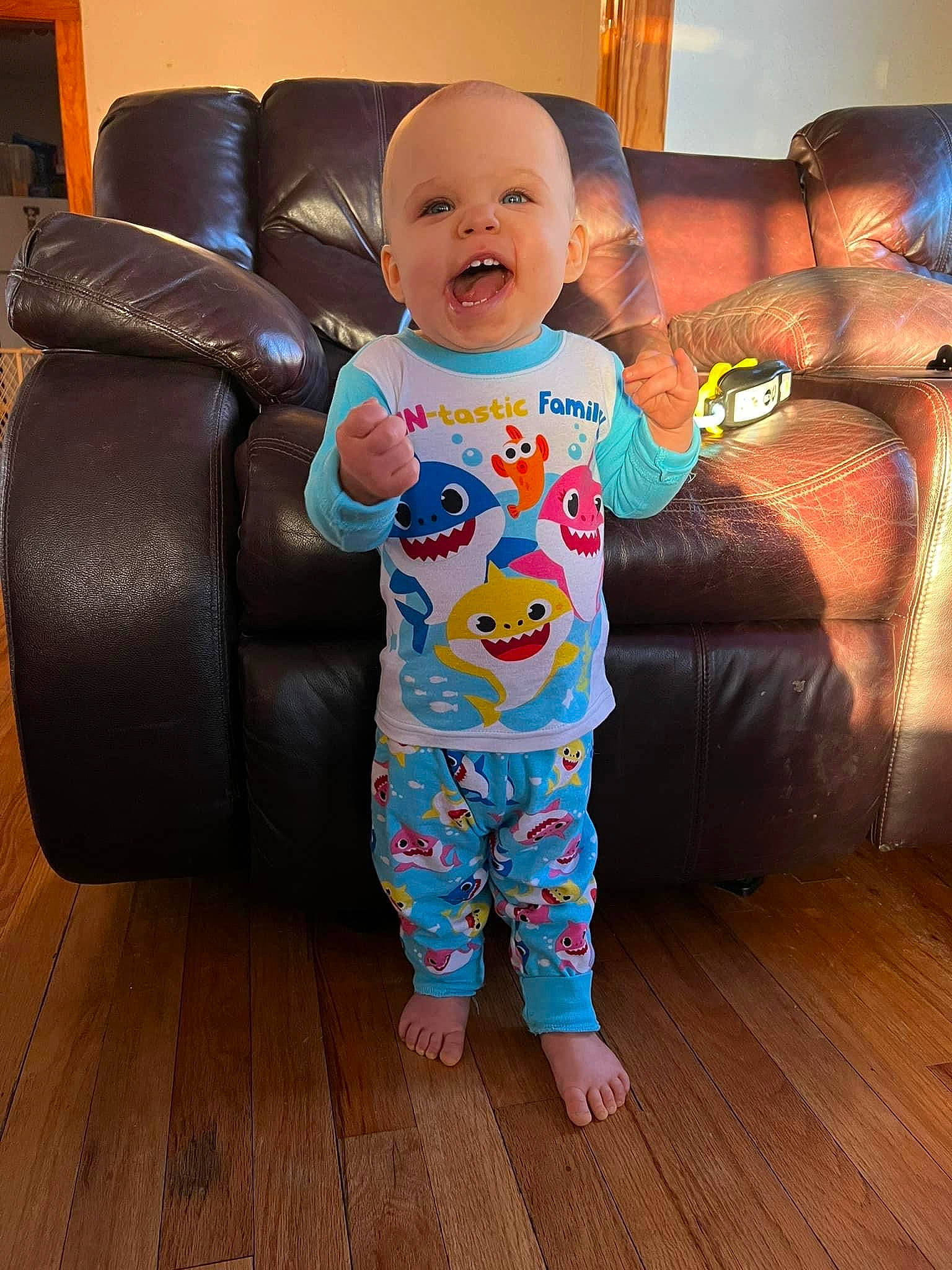 Russell joined the competition — help win amazing prizes! baby, baby_toddler_clothing, chair, child, comfort, couch, eye, floor, flooring, fun, furniture, hairstyle, happy, hardwood, living_room, person, skin, sleeve, smile, toddler