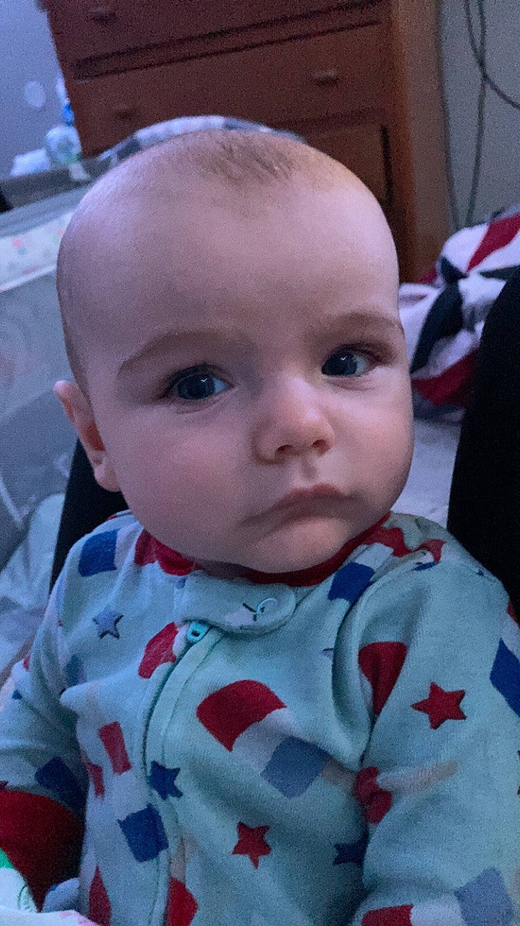 Cayden is registered to the contest to win money with this photo: baby, baby_toddler_clothing, carmine, cheek, child, chin, collar, comfort, dress_shirt, eyelash, iris, lip, mouth, nose, pattern, person, skin, sleeve, toddler