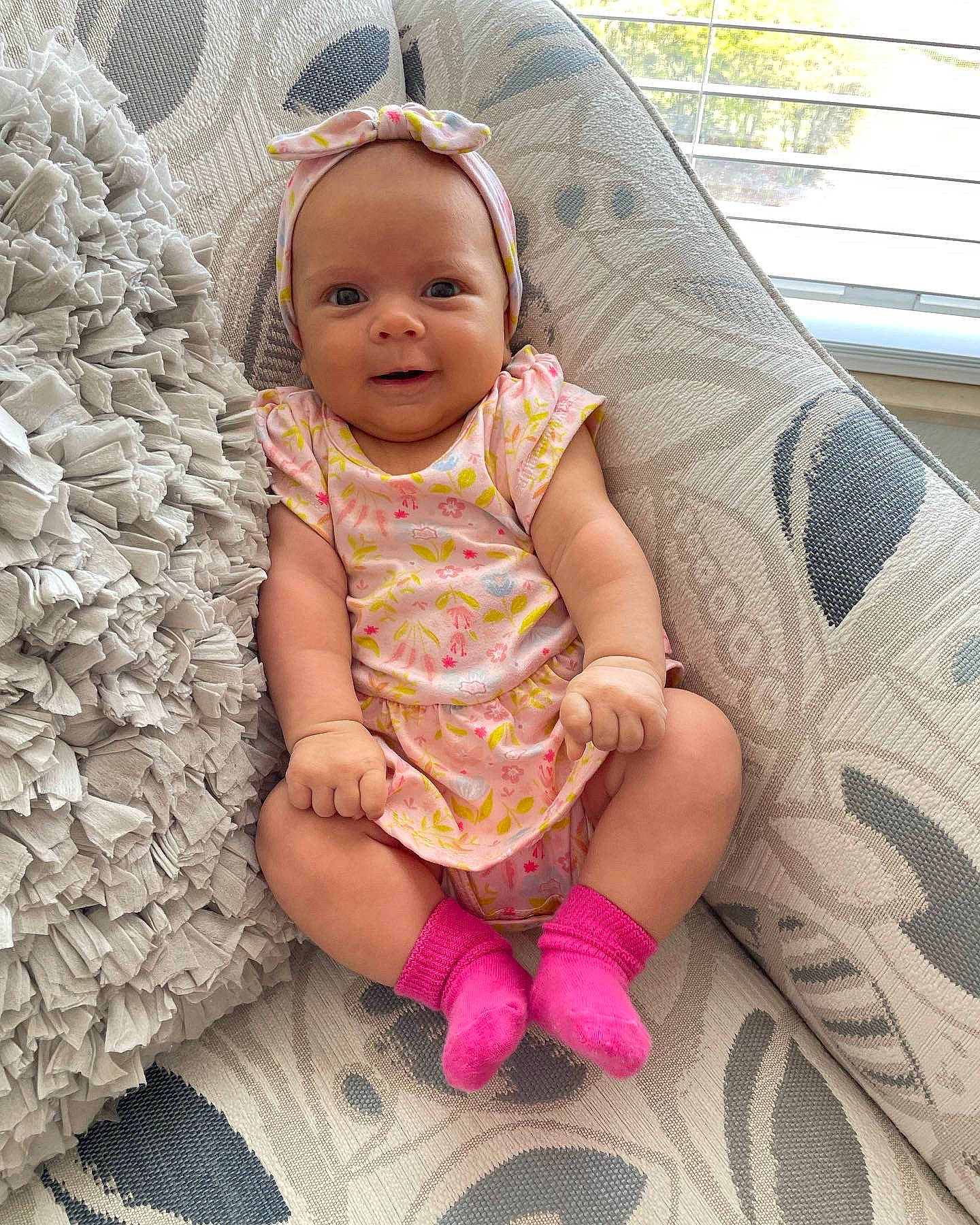 Brielle joined the competition — help win amazing prizes! baby, baby_toddler_clothing, cheek, child, comfort, eye, foot, grass, happy, hat, head, linens, pattern, person, pink, sitting, skin, smile, sun_hat, thigh