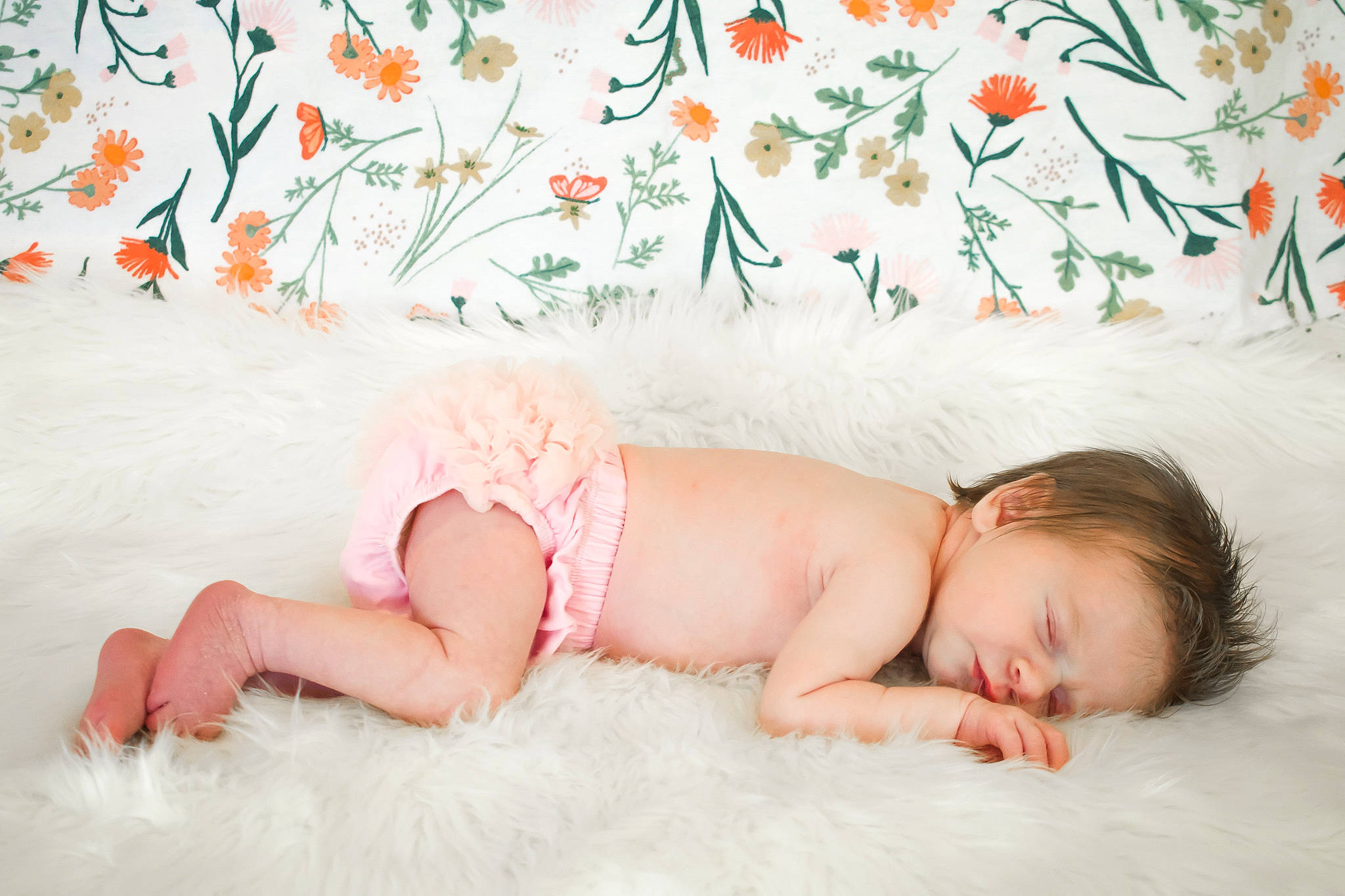 Jennifer is registered to the contest to win money with this photo: art, baby, baby_toddler_clothing, barefoot, comfort, flooring, flower, foot, grass, happy, linens, morning, pattern, person, pink, plant, skin, summer, textile, thigh