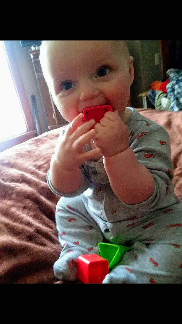 Roman is registered to the contest to win money with this photo: baby, cheek, child, finger, lip, mouth, nose, person, play, skin, thumb, toddler