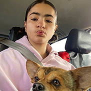 Aniya joined the competition — help win amazing prizes! person, child, dog, car_interior, seatbelt, hoodie, puppy, pet, animal, face, ears, window, seat, headrest, young_person, casual_clothing, portrait, selfie, cute, indoor