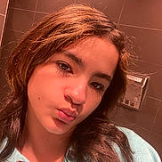 Aniya is registered to the contest to win money with this photo: bathroom, casual, clothing, expression, eyebrows, face, hair, hand_dryer, head, hoodie, human, indoor, lighting, person, portrait, pout, selfie, skin, tile_wall, young