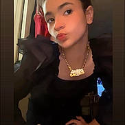 Aniya is registered to the contest to win money with this photo: accessory, background, black_clothing, casual, clothing, doorway, expression, face, fashion, hand_on_hip, indoor, light, necklace, person, portrait, pose, puffed_sleeves, standing, young_face, young_person