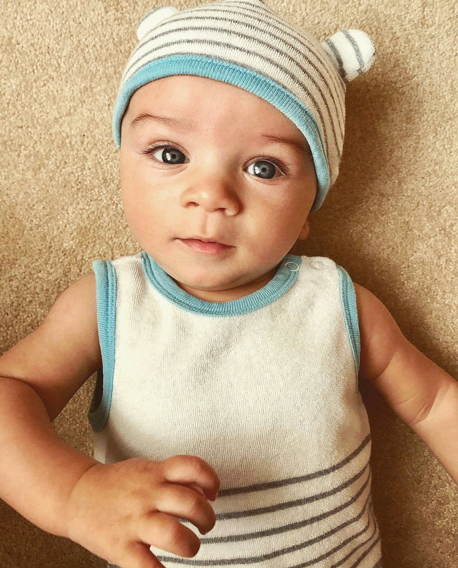 Reid joined the competition — help win amazing prizes! beanie, bonnet, cap, cheek, child, girl, hair_accessory, hat, headgear, infant, knit_cap, knitting, person, product, toddler, wool