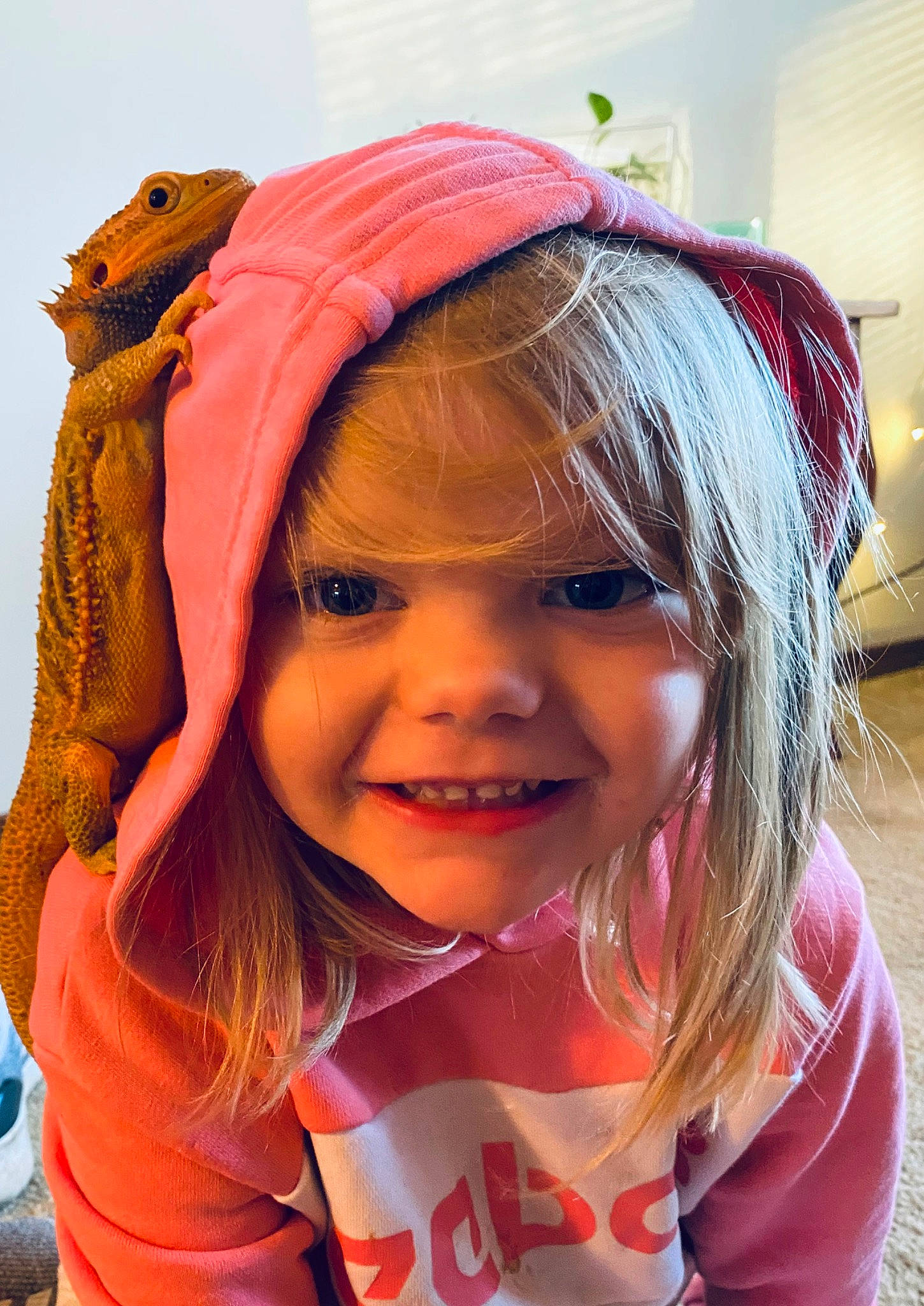 Coraline is registered to the contest to win money with this photo: child, chin, cool, costume, costume_hat, event, eye, fashion_accessory, fun, hair_accessory, happy, headgear, headwear, iris, joy, magenta, mouth, person, pink, plant