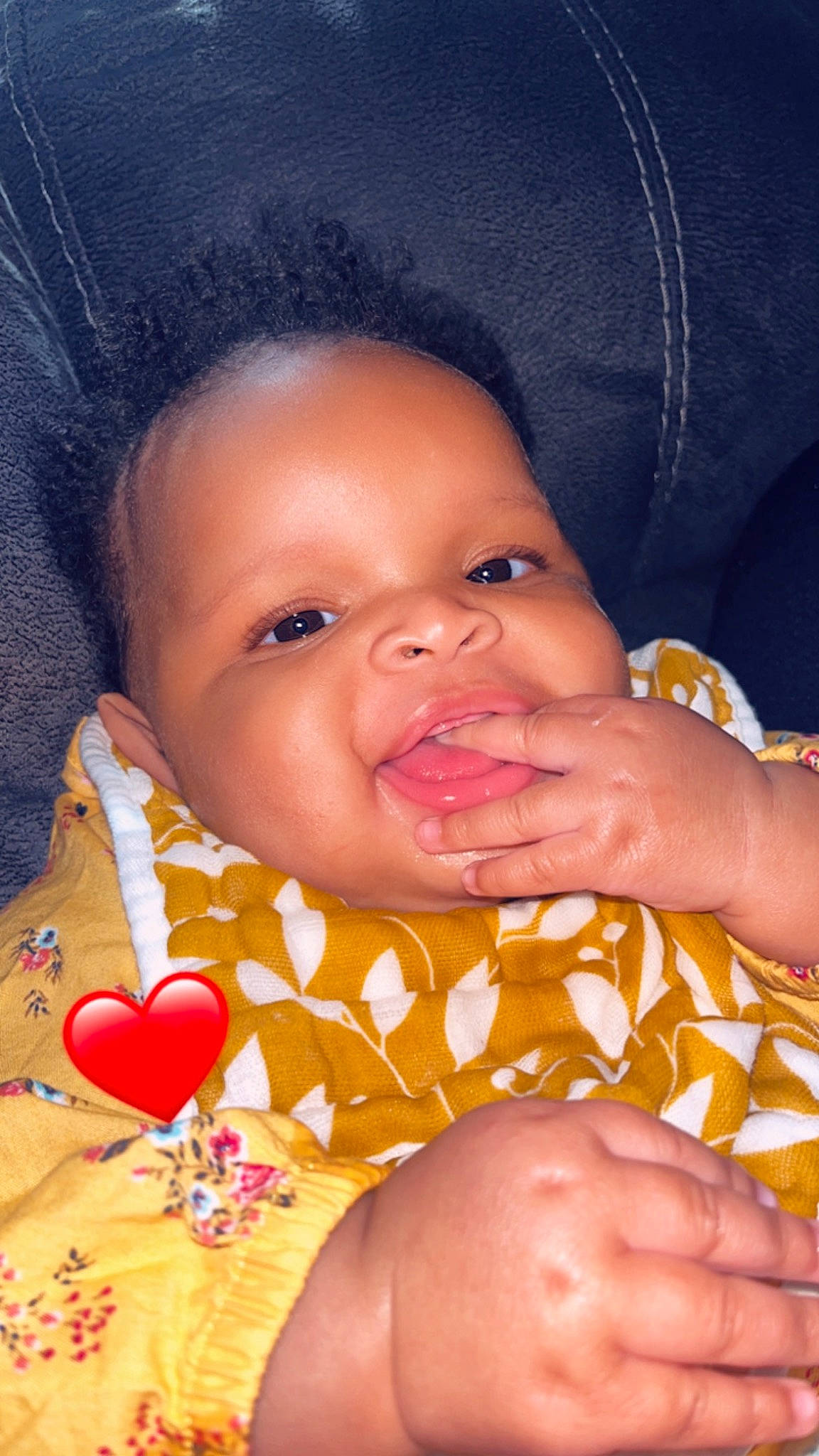 Laylani joined the competition — help win amazing prizes! baby_toddler_clothing, cheek, chin, face, facial_expression, finger, hair, head, human, human_body, lip, mouth, neck, nose, orange, organ, person, product, skin, smile