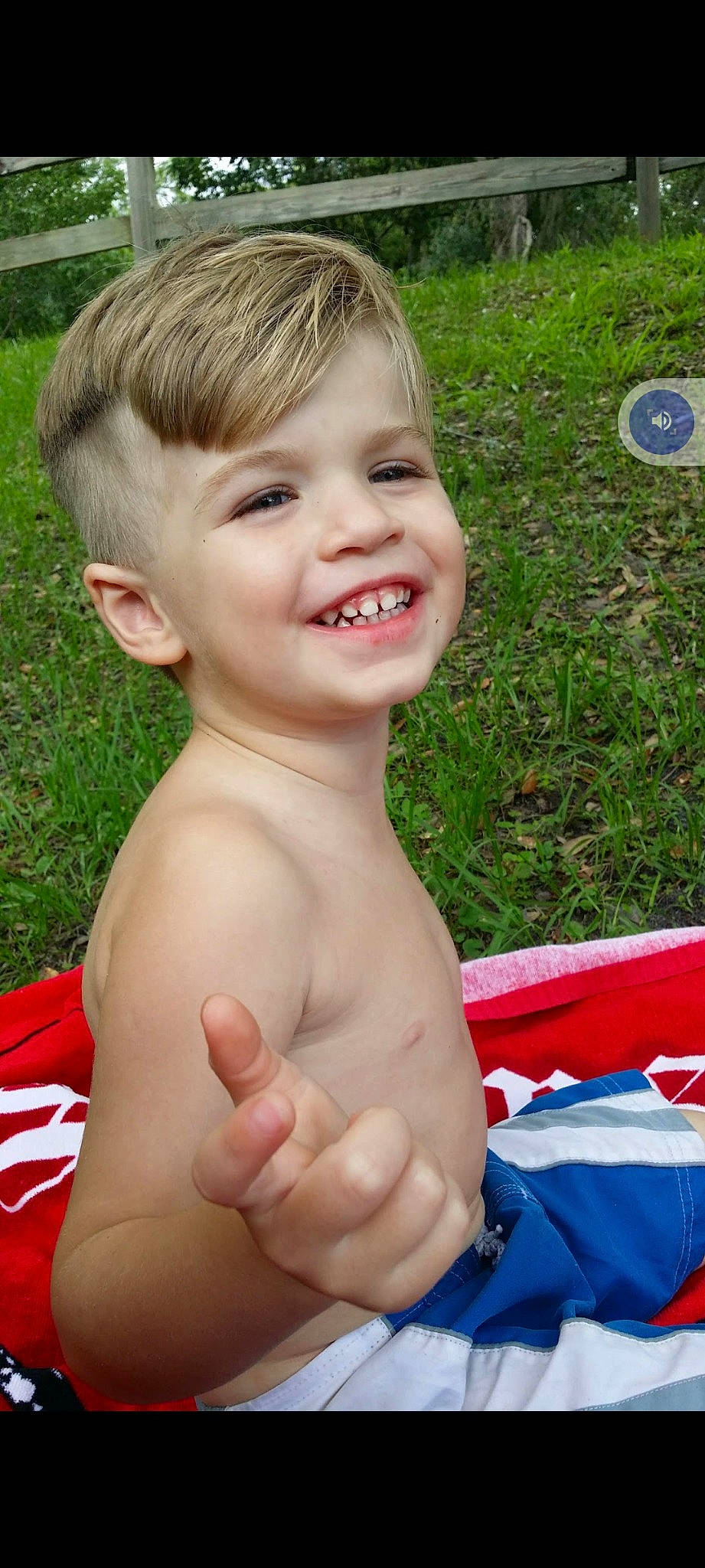 Chase is registered to the contest to win money with this photo: arm, blue, cheek, chest, chin, eye, finger, fun, gesture, grass, happy, human_body, joy, muscle, neck, nose, people_in_nature, person, skin, smile