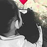 child, cat, black_cat, cuddle, hug, back_view, heart_emoji, pink_stars, overlay, cozy, blanket, indoor, monochrome, whimsical, affection, pet, love, cute, together, soft_lighting