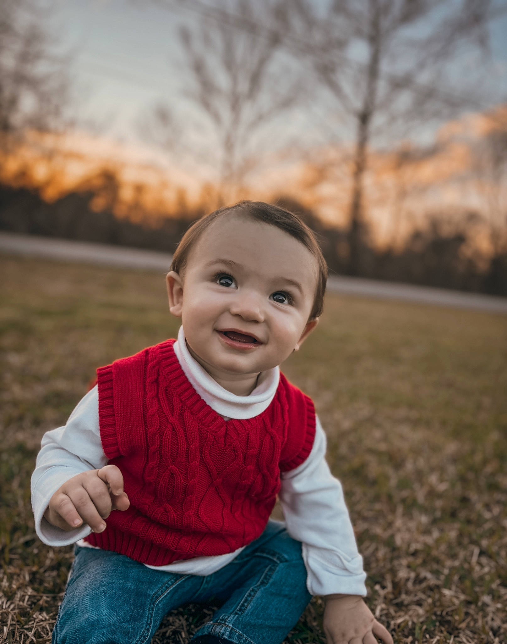 Westyn is registered to the contest to win money with this photo: baby_toddler_clothing, cheek, clothing, eye, flash_photography, grass, happy, head, iris, joy, people_in_nature, person, plant, skin, sky, smile, standing, sunlight, toddler, tree