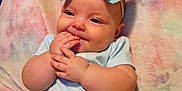 Irismae is registered to the contest to win money with this photo: baby, child, blue_bow, headband, light_blue_clothing, pastel_blanket, cheeks, smile, fingers, sitting, cute, infant, indoors, soft_texture, happy, chubby, portrait, young_child, comfortable, cozy