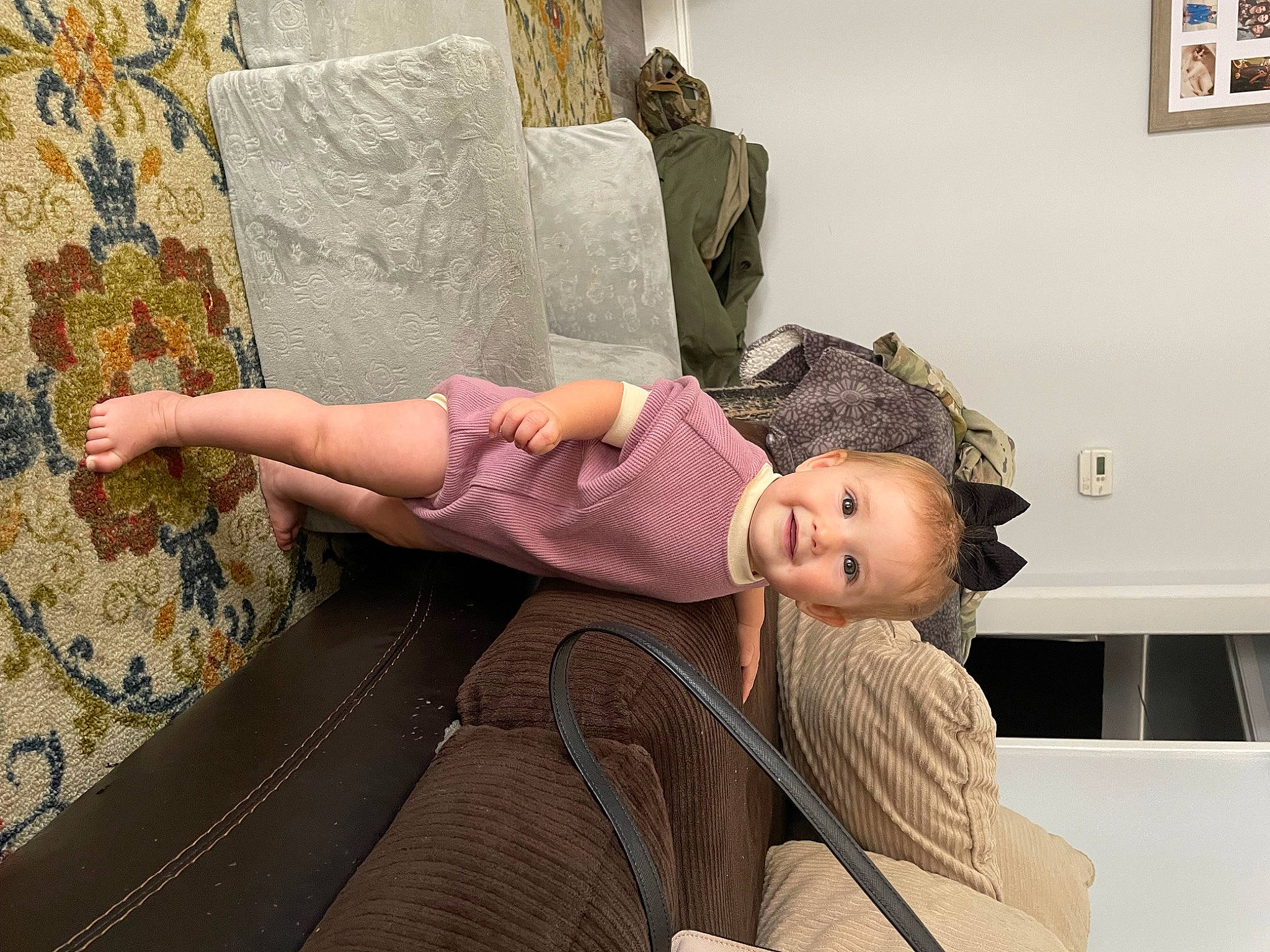 Indie is registered to the contest to win money with this photo: art, child, comfort, doll, flooring, fun, human_leg, joy, leisure, linens, person, picture_frame, room, sitting, smile, toddler, toy, tree, vacation, visual_arts