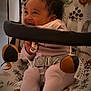 baby, infant, smiling, curly_hair, baby_seat, toy, indoor, child, clothing, happy, playful, comfort, soft_toy, seat_belt, cute, pattern, fabric, person, closeup, toddler