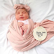 Joyanne Noelle is registered to the contest to win money with this photo: baby, baby_clothes, birth_announcement, blanket, cute, headband, infant, lying_down, newborn, newborn_photo, peaceful, pink, plush, portrait, resting, sleeping, soft, white, wooden_plaque, wrapped