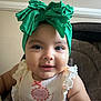 Aliany is registered to the contest to win money with this photo: baby, child, smiling, headband, green_bow, face, infant, cute, portrait, clothing, sitting, indoor, apparel, closeup, expression, happy, young_child, person, fashion, accessory
