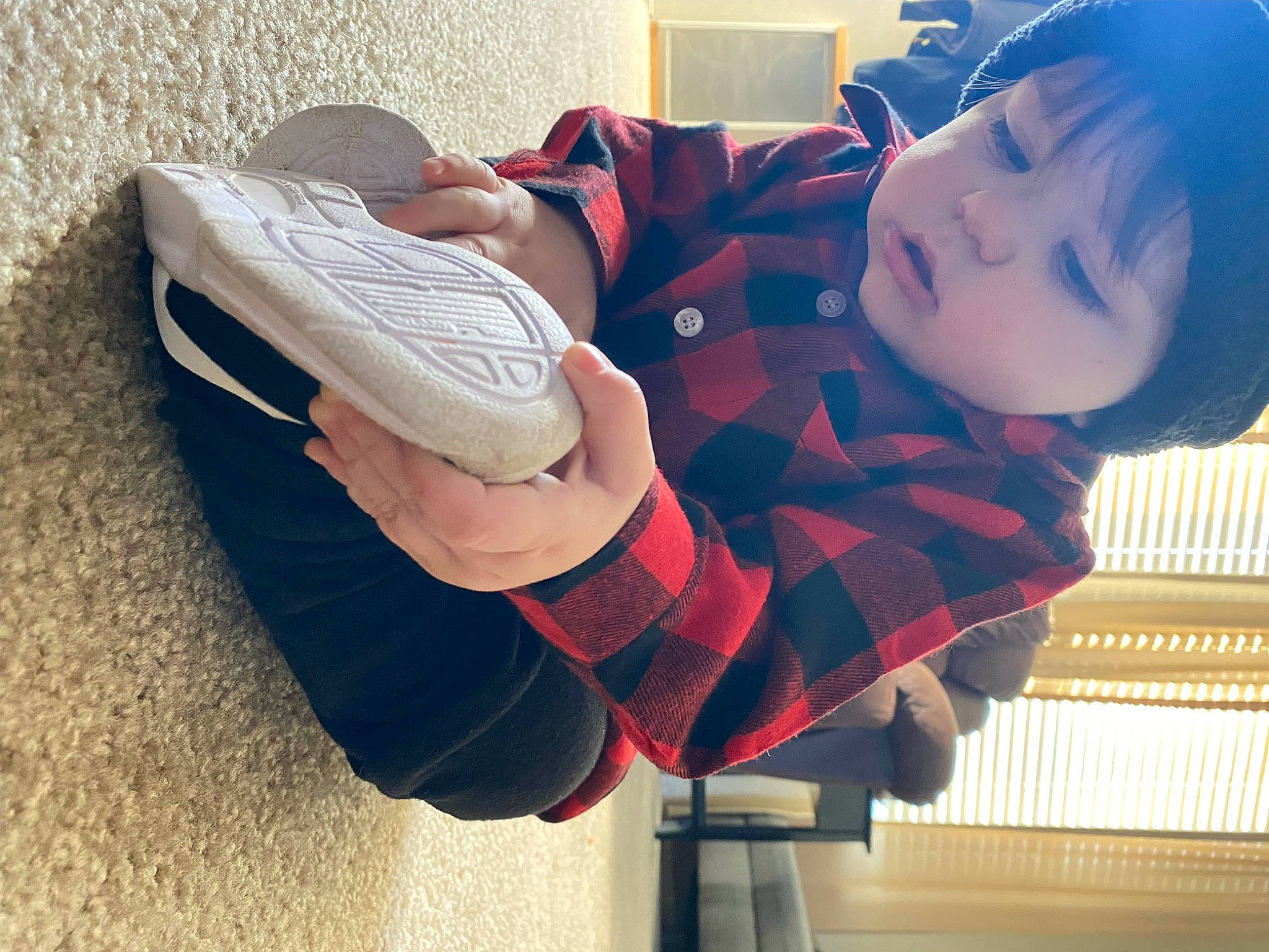 Jeromy is registered to the contest to win money with this photo: baby, comfort, cool, elbow, finger, flooring, happy, headgear, human_leg, knee, leg, leisure, pattern, person, plaid, sleeve, t_shirt, tartan, thigh, toddler