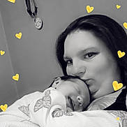 Tracie joined the competition — help win amazing prizes! woman, child, baby, sleeping, kiss, love, affection, black_and_white, heart_overlay, butterfly_pattern, portrait, indoor, close_up, cuddle, family, warmth, tenderness, person, cute, sleep