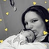 woman, child, baby, sleeping, kiss, love, affection, black_and_white, heart_overlay, butterfly_pattern, portrait, indoor, close_up, cuddle, family, warmth, tenderness, person, cute, sleep