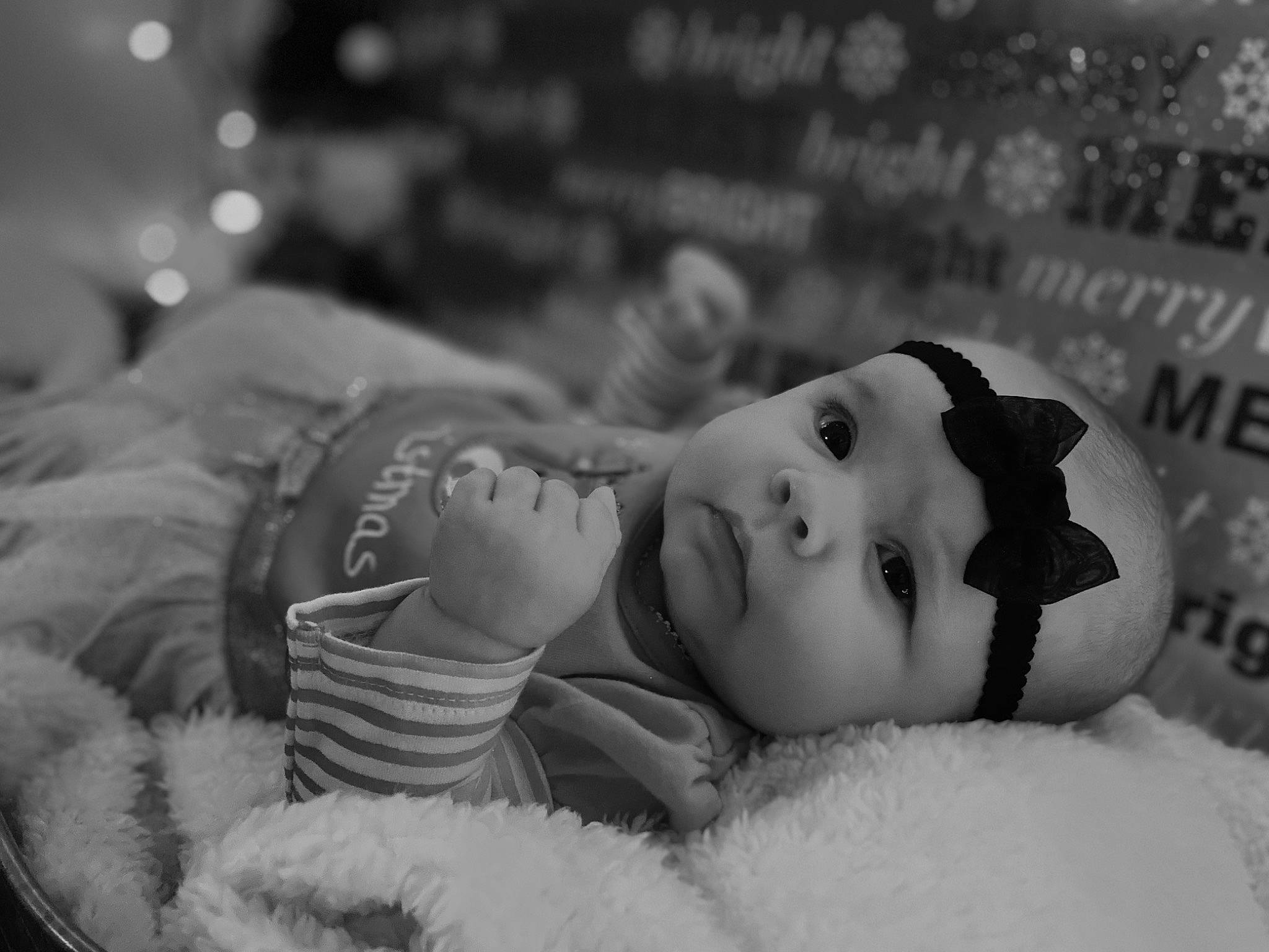 Jaeleigh is registered to the contest to win money with this photo: baby, black_and_white, child, comfort, fur, hair_accessory, headgear, headwear, love, monochrome, monochrome_photography, person, photo_shoot, portrait_photography, toddler, winter