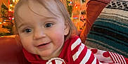 Audrey is registered to the contest to win money with this photo: baby, blanket, clothing, couch, cushion, face, festival, furniture, happy, head, homedecor, lighting, pajamas, person, photography, plant, portrait, pottedplant, sitting, smile