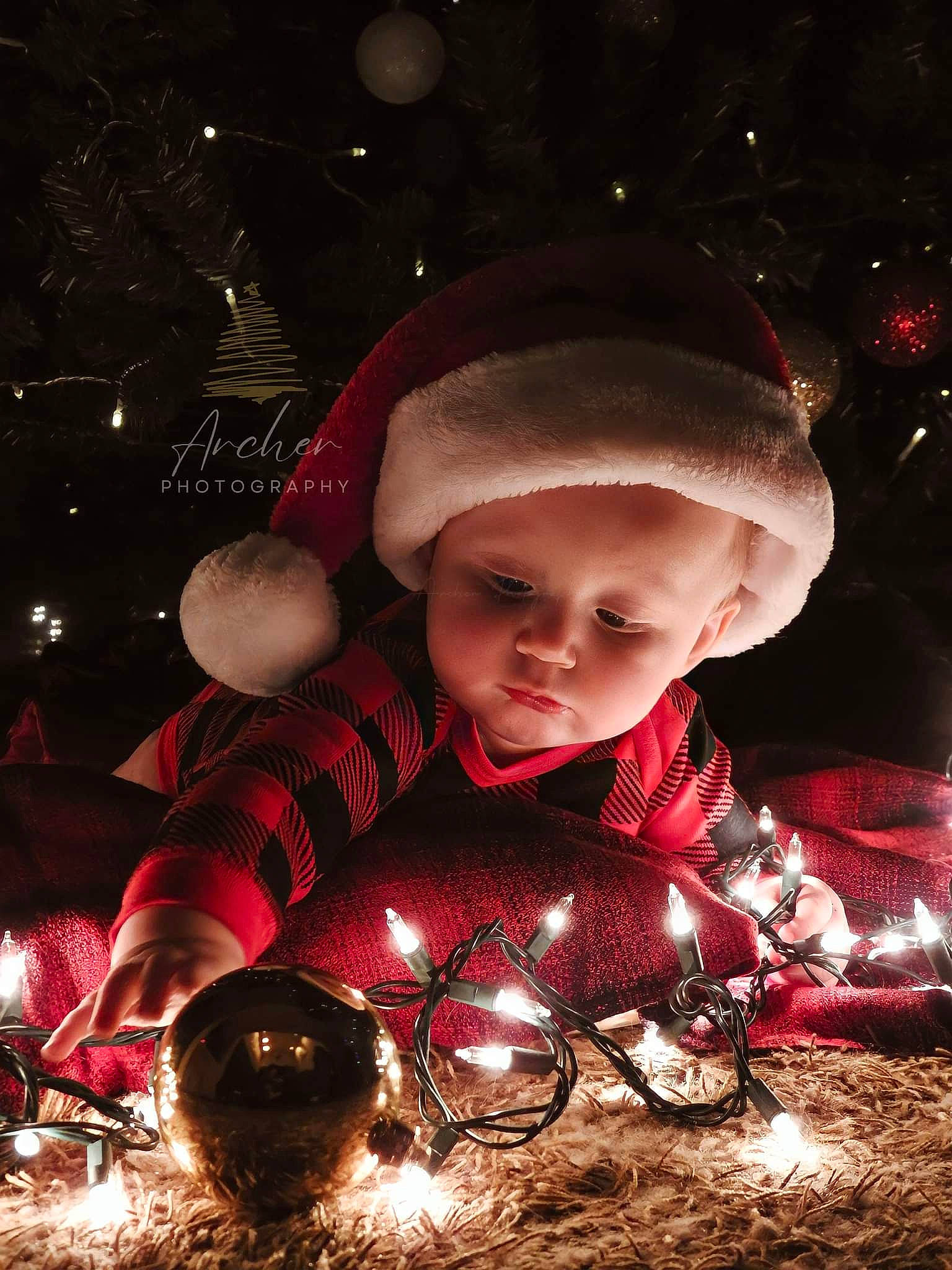 Rhydian joined the competition — help win amazing prizes! automotive_lighting, christmas, christmas_decoration, christmas_eve, christmas_lights, christmas_ornament, darkness, event, flash_photography, fun, happy, holiday, holiday_ornament, human, midnight, ornament, person, space, toddler, tradition