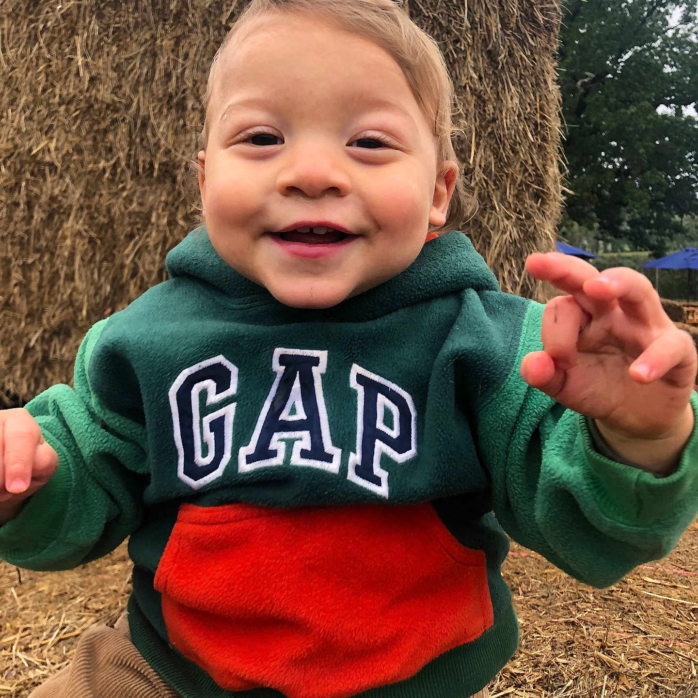 Jacob joined the competition — help win amazing prizes! baby, bodypart, clothing, coat, face, finger, grass, hand, happy, head, jacket, knitwear, outdoors, pants, person, photography, plant, portrait, sweater, sweatshirt