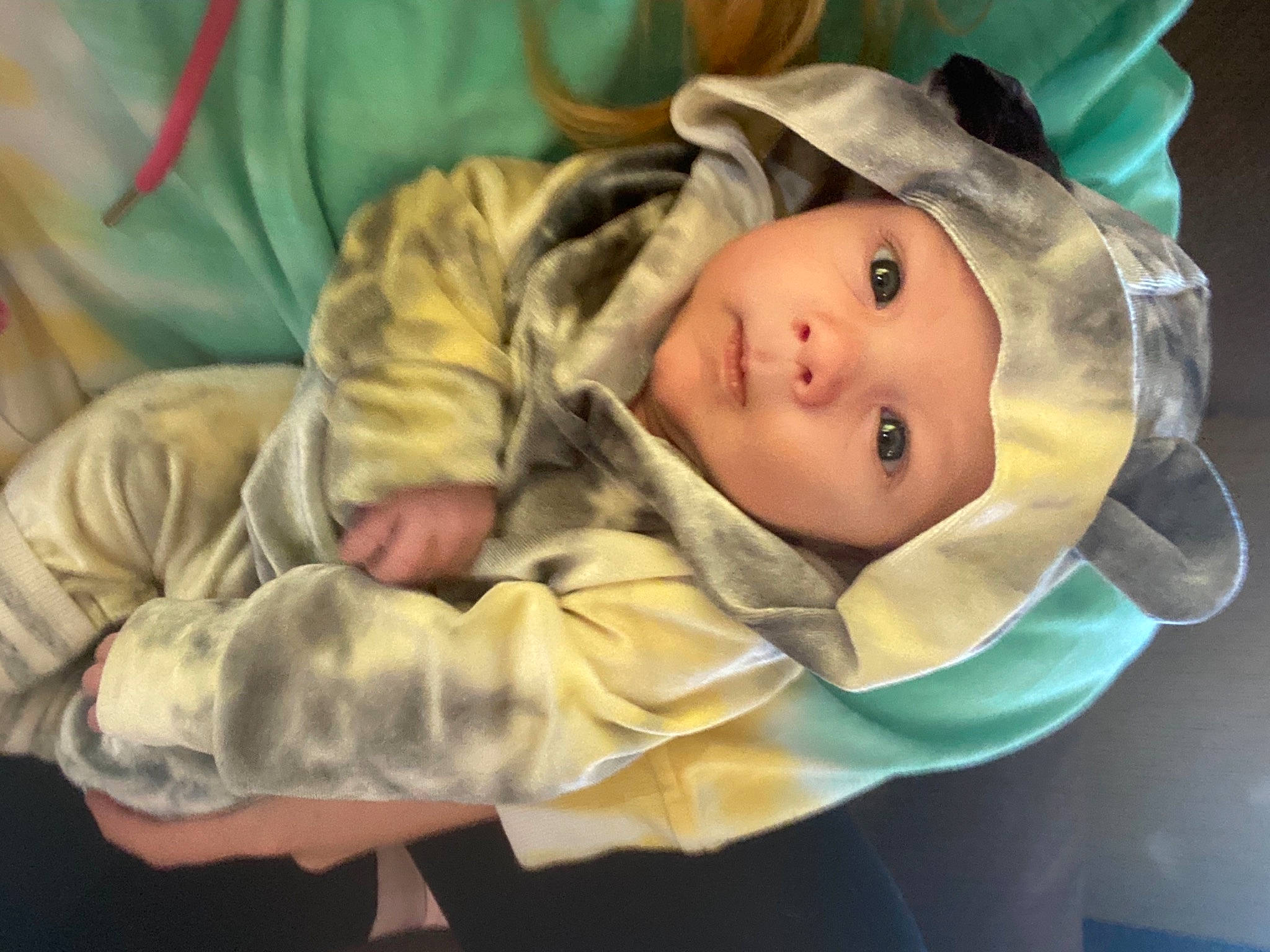 Lincoln is registered to the contest to win money with this photo: baby, baby_products, baby_safety, baby_toddler_clothing, camouflage, cheek, child, comfort, eye, face, grass, hat, head, headgear, headwear, linens, person, room, sleeve, smile