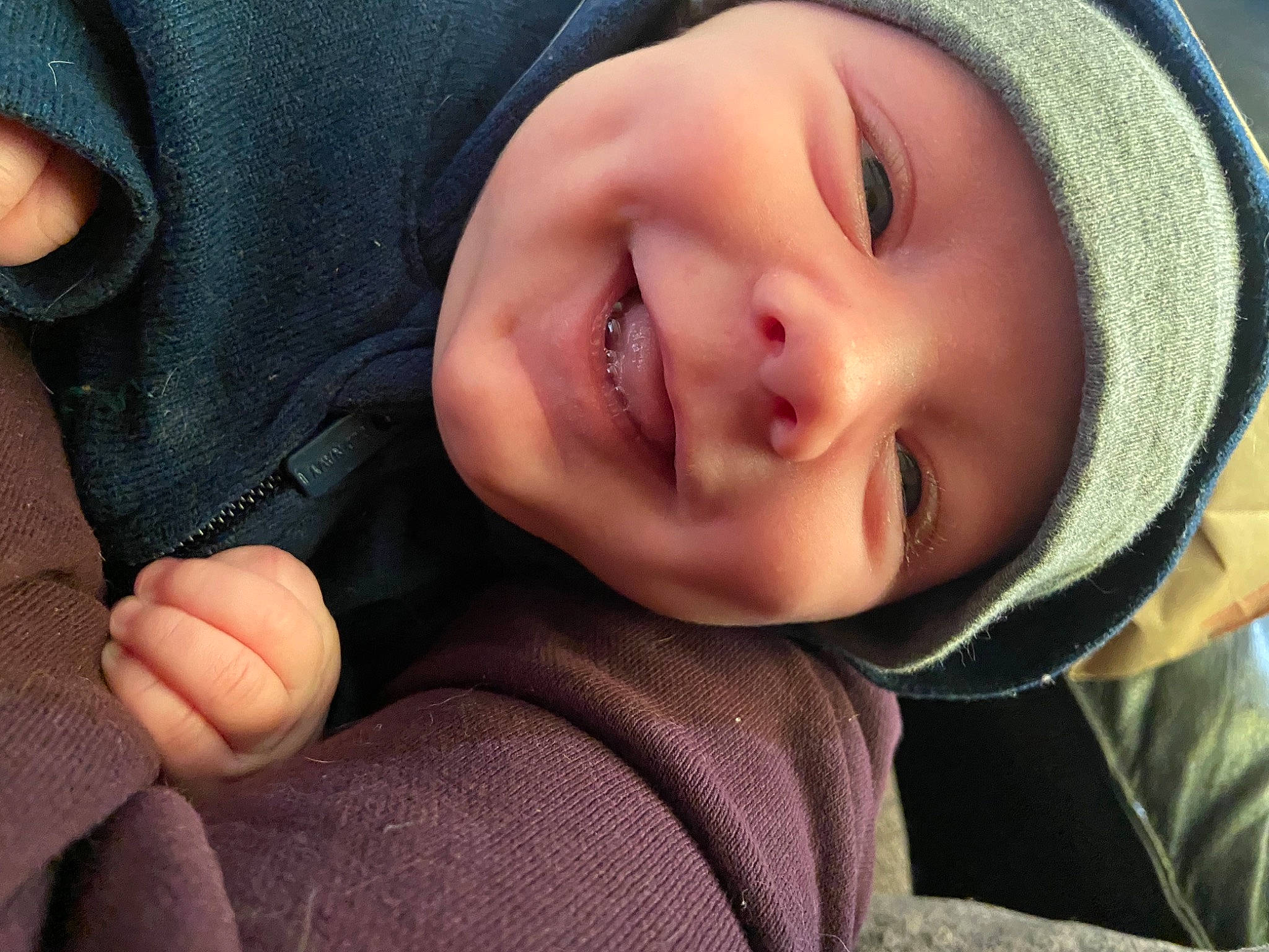 Lincoln is registered to the contest to win money with this photo: baby, cap, cheek, eye, eyebrow, eyelash, face, finger, gesture, grass, happy, hat, head, headgear, headwear, joy, lip, mouth, nose, person