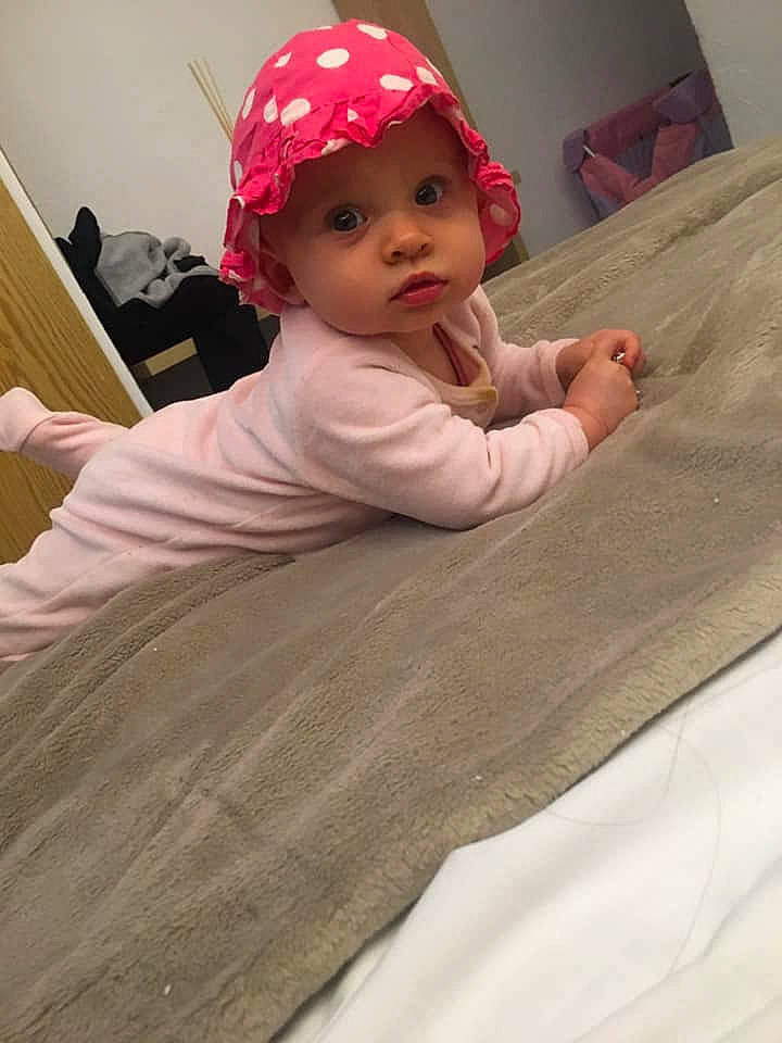 Nellya participe au concours pour gagner de l'argent avec cette photo : baby, baby_toddler_clothing, cap, carmine, cheek, child, comfort, eyebrow, flooring, fun, hardwood, headwear, linens, lip, person, room, skin, sleeve, t_shirt, textile