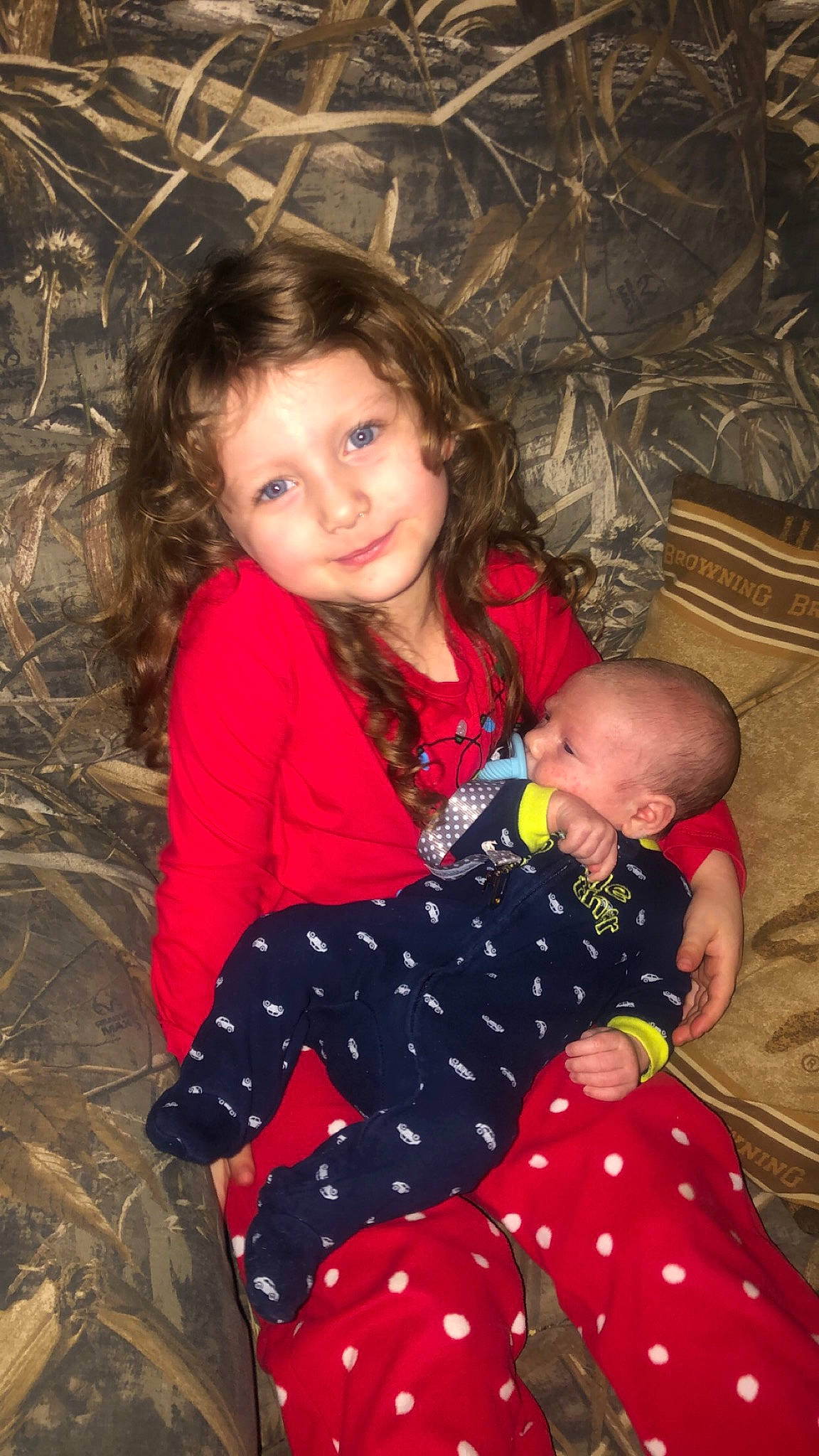 Skylee is registered to the contest to win money with this photo: baby, baby_toddler_clothing, brown_hair, child, child_model, comfort, human, iris, joy, lap, nightwear, overall, pajamas, person, polka_dot, sock, toddler