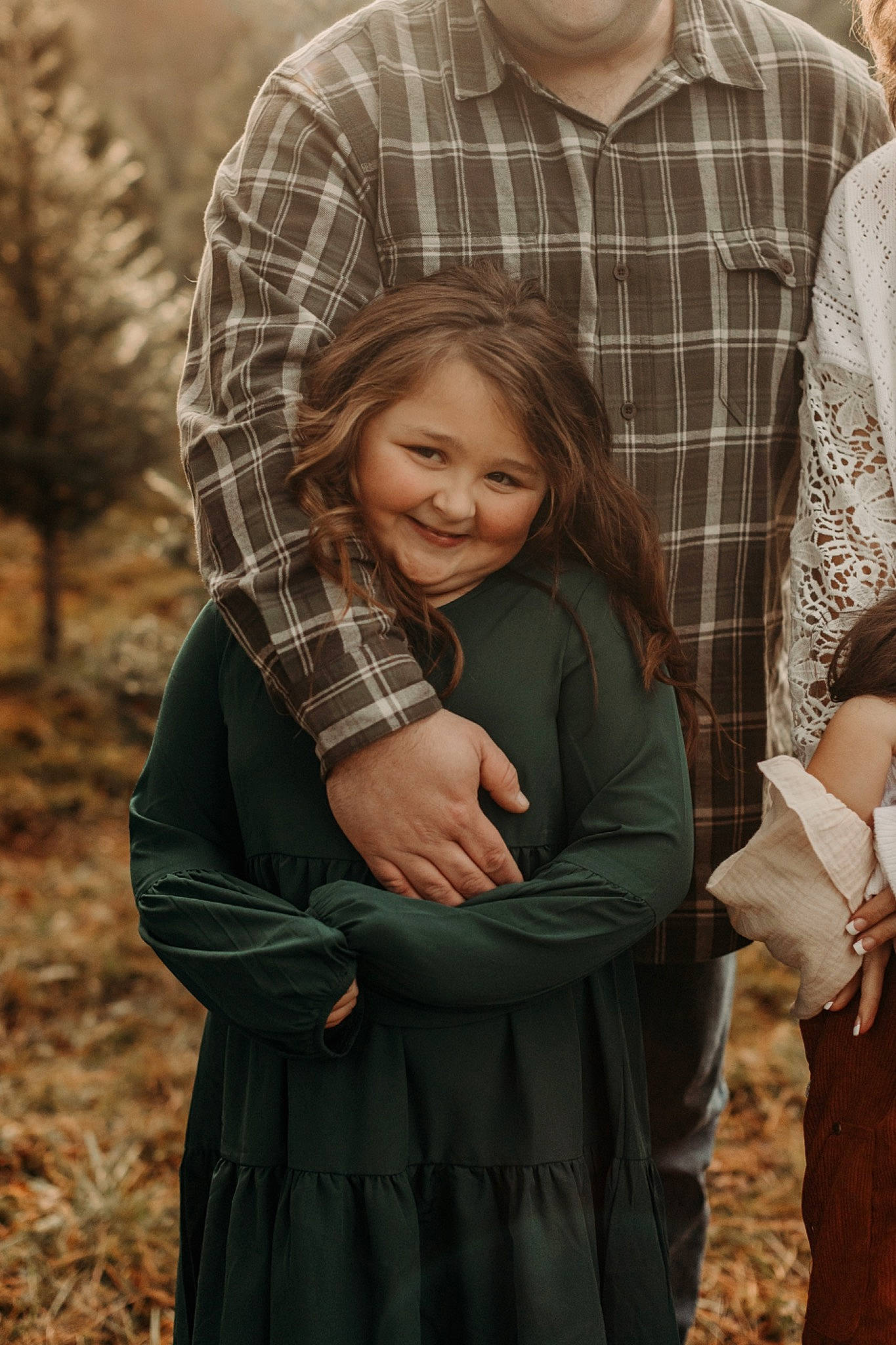 Donna is registered to the contest to win money with this photo: child, event, gesture, grass, grey, happy, joy, outerwear, pattern, people, people_in_nature, person, photograph, plaid, plant, sleeve, smile, spring, standing, tartan