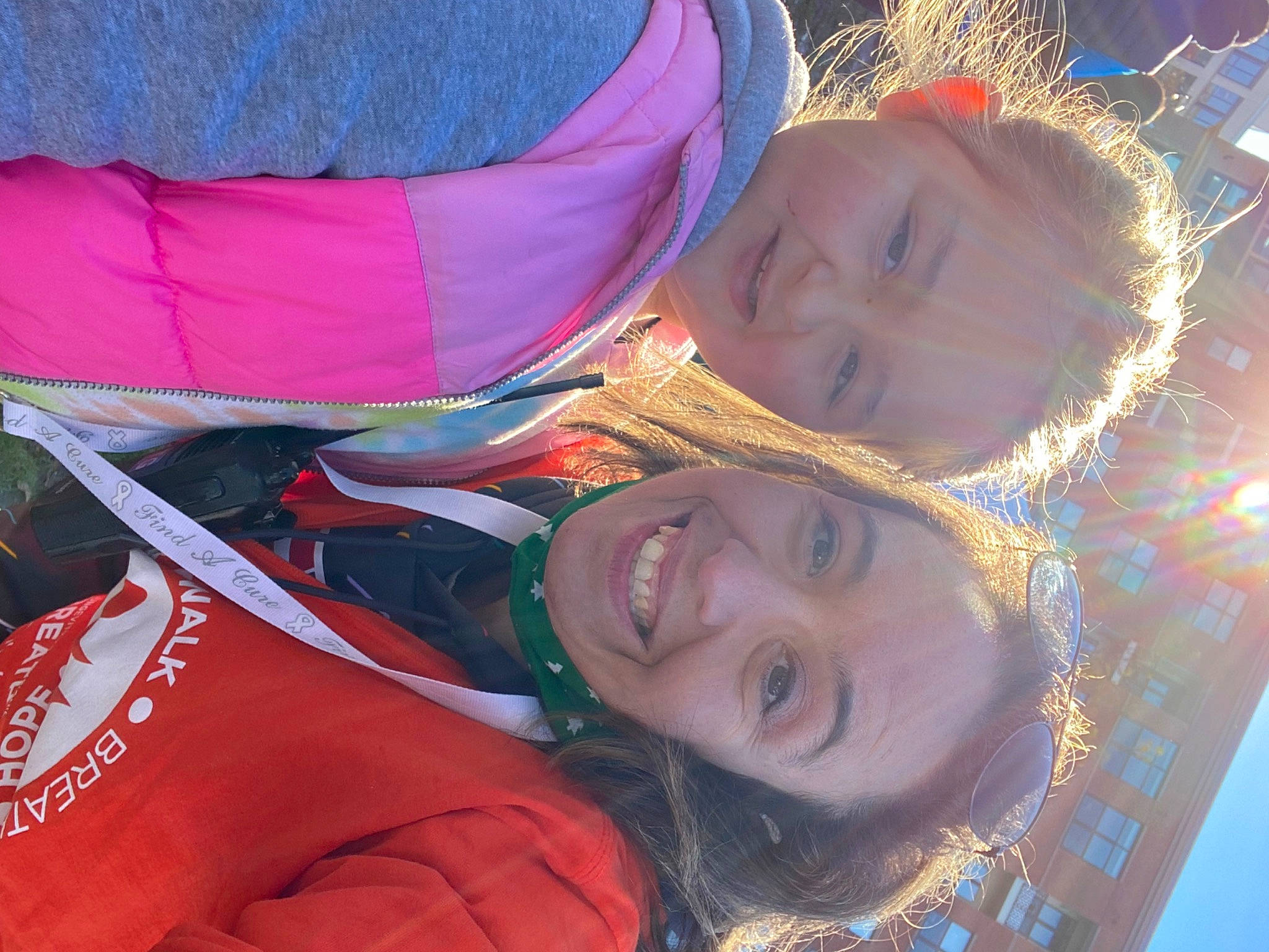 Donna is registered to the contest to win money with this photo: baby, child, event, fun, grass, happy, joy, laugh, leisure, people_in_nature, person, personal_protective_equipment, recreation, selfie, sky, smile, toddler, tree, vacation, winter