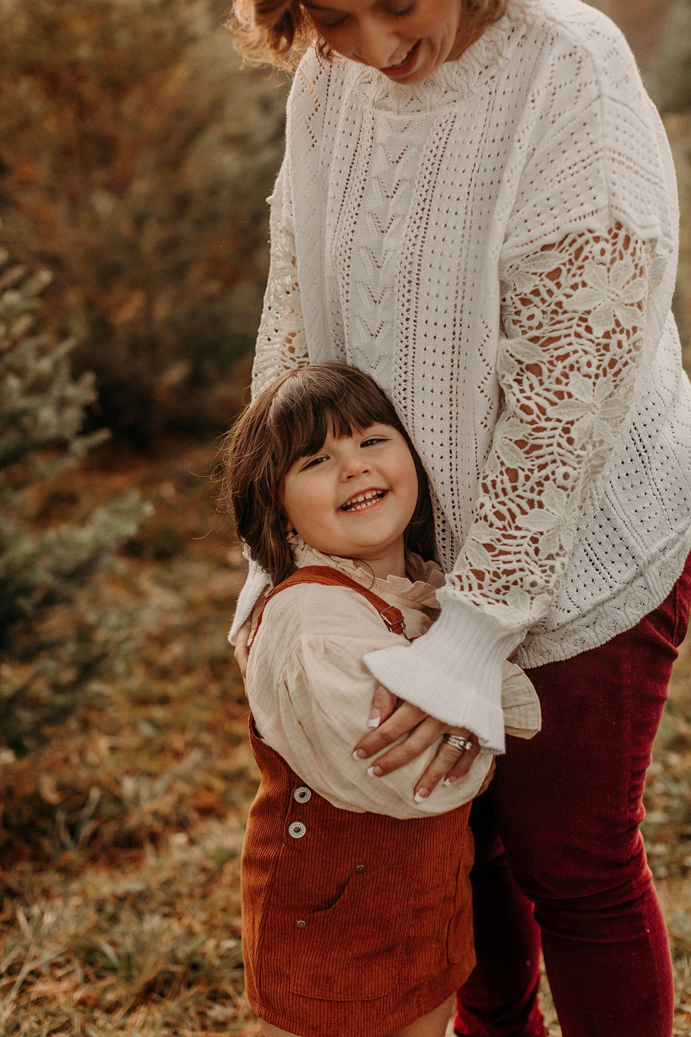 Charlotte is registered to the contest to win money with this photo: arm, clothing, eye, gesture, grass, hand, happy, head, human_body, interaction, iris, joy, outerwear, people_in_nature, person, photograph, plant, skin, sleeve, smile