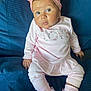 Romi-Dalton is registered to the contest to win money with this photo: baby, infant, pink_clothing, headband, bow, sitting, blue_blanket, texture, cute, child, soft_light, portrait, young, sock, home, indoor, fashion, small_hands, expression, person
