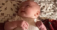 Paisley joined the competition — help win amazing prizes! baby, blanket, child, clothing, curious, cute, fabric, head, indoor, infant, lying_down, pattern, person, portrait, resting, skin, sleepwear, small_hands, soft_lighting, warm