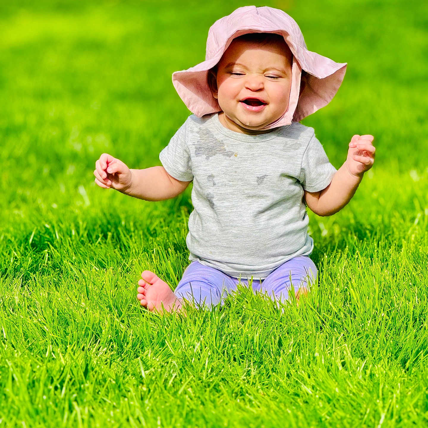 Ada joined the competition — help win amazing prizes! baby, babylaughing, bonnet, clothing, face, field, grass, grassland, happy, hat, head, lawn, nature, outdoors, person, photography, plant, portrait, sitting, sunhat