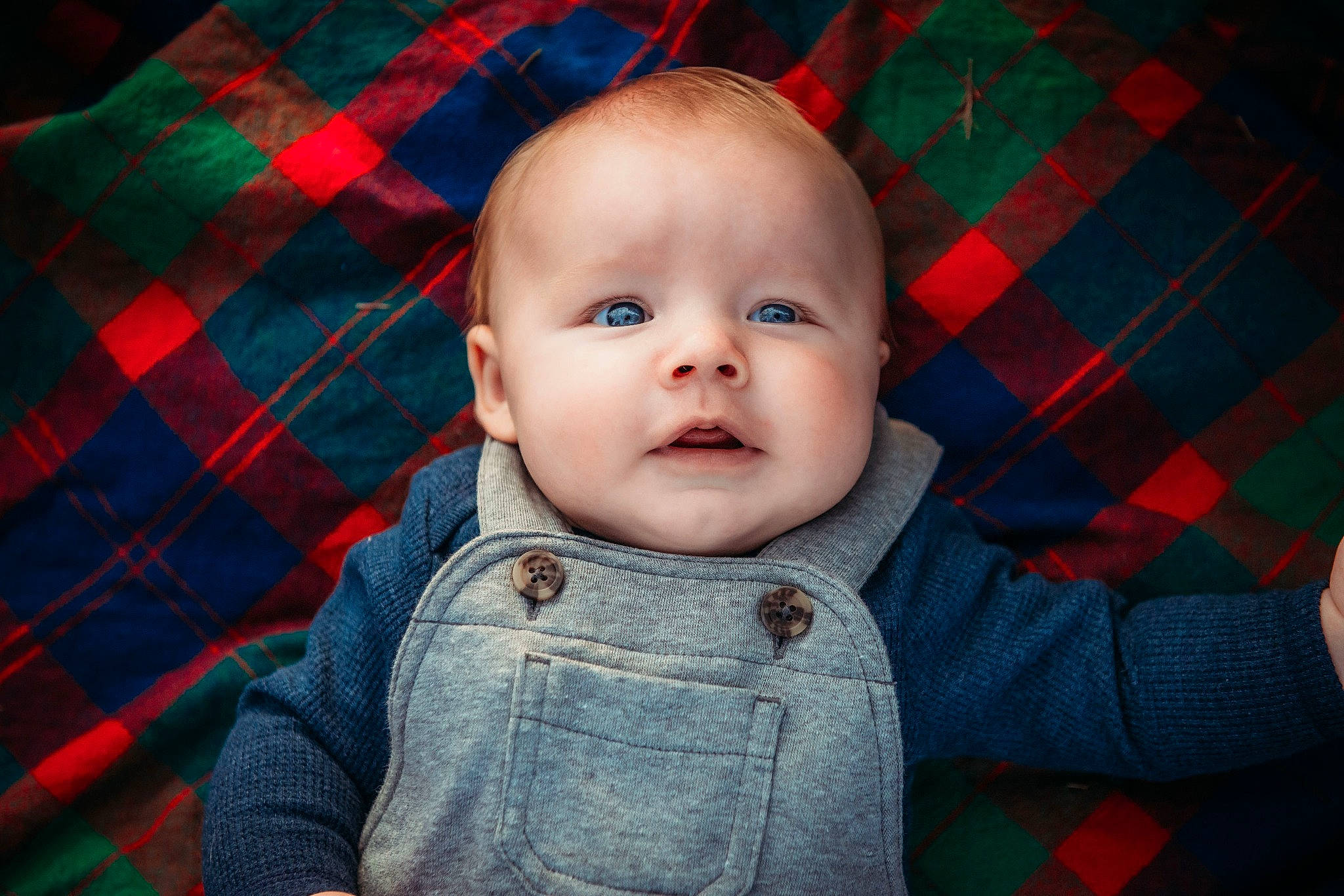 Gary is registered to the contest to win money with this photo: baby, baby_toddler_clothing, cheek, child, comfort, design, ear, iris, linens, lip, pattern, person, plaid, portrait_photography, red, sleeve, sweater, tartan, textile, toddler