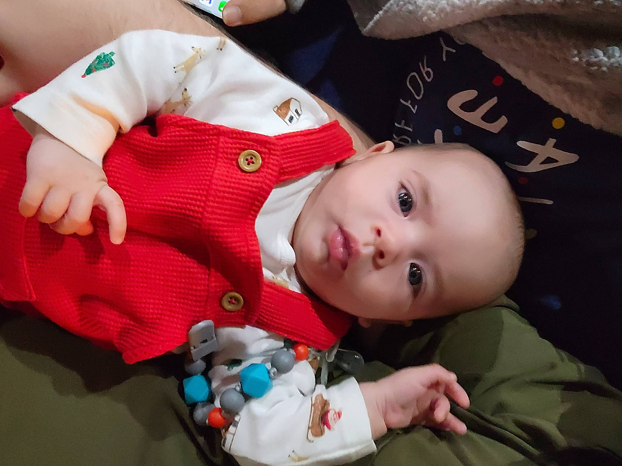 Jorge is registered to the contest to win money with this photo: baby, baby_products, baby_toddler_clothing, button, carmine, cheek, child, event, eye, happy, pattern, person, plaid, product, room, sitting, skin, sleeve, smile, toddler