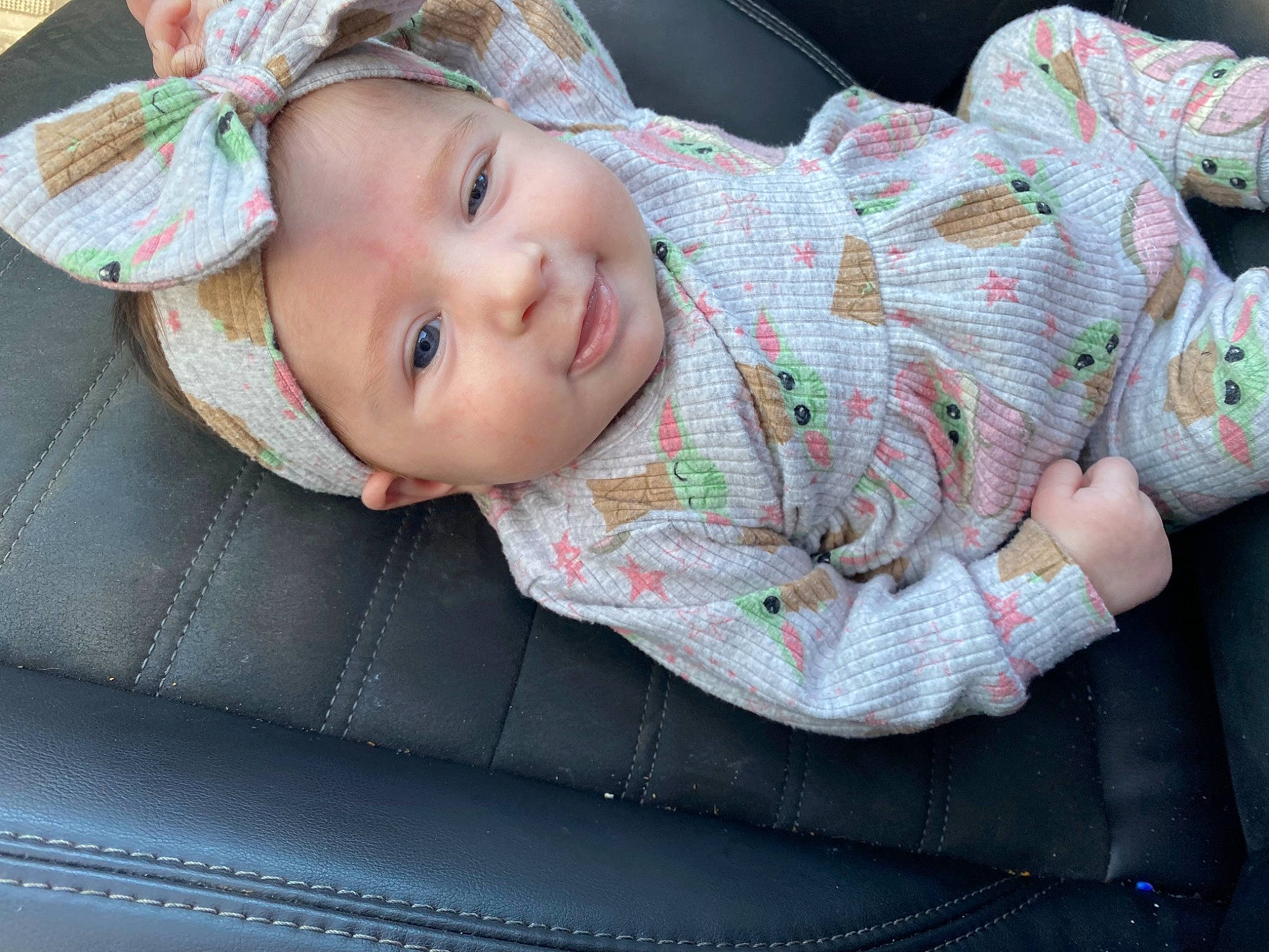 Oaklyn is registered to the contest to win money with this photo: baby, baby_products, baby_toddler_clothing, cheek, child, comfort, eye, face, grass, happy, hat, head, headwear, pattern, person, plaid, sitting, sleeve, smile, sun_hat