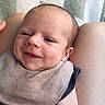 Waylon joined the competition — help win amazing prizes! baby, infant, smile, face, arm, bib, clothing, skin, person, legs, blanket, pattern, indoor, closeup, cute, newborn, happy, young, portrait, resting