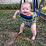 baby, child, swing, smiling, outdoor, grass, backyard, fence, play, happy, blue_eyes, infant, sunlight, nature, barefoot, cute, person, sitting, fabric, support_straps