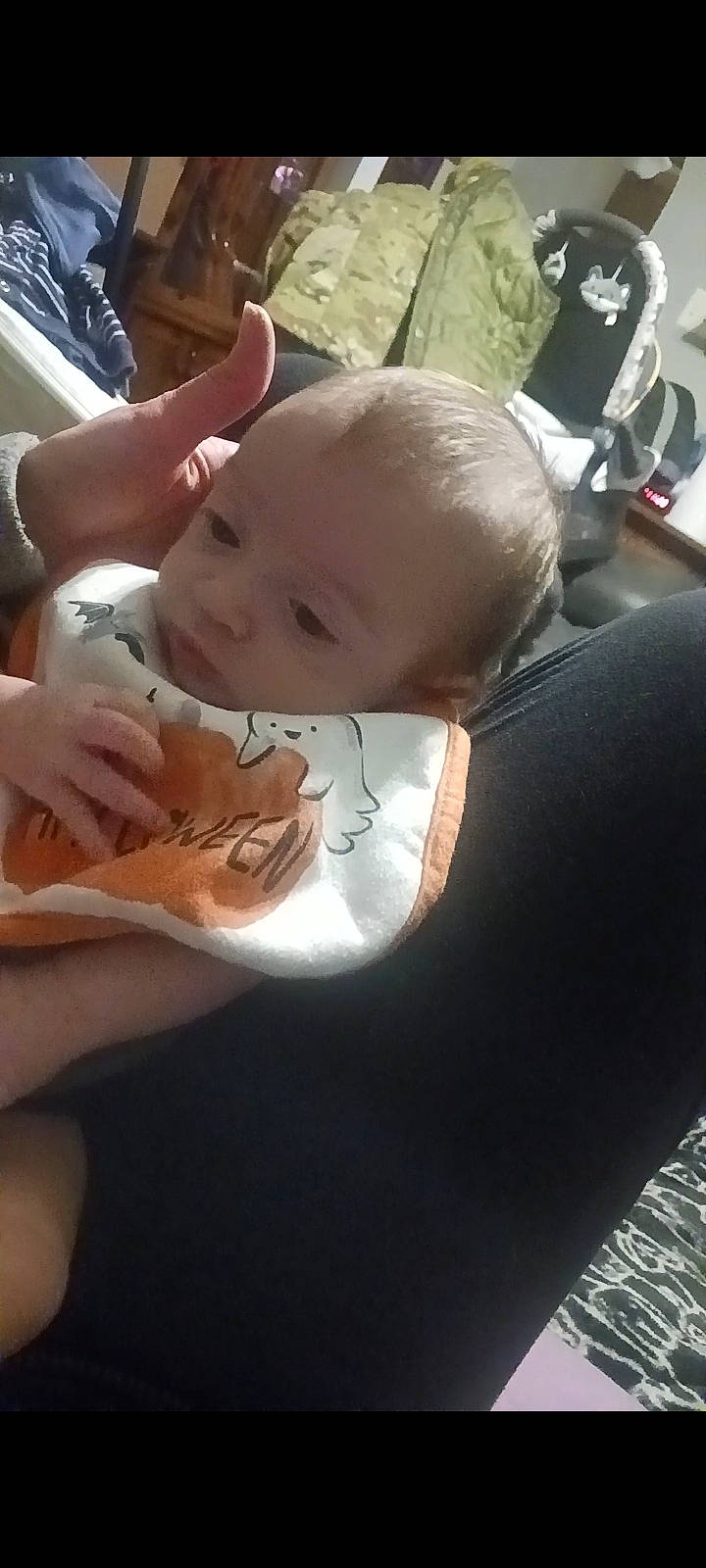 Castiel is registered to the contest to win money with this photo: baby, baby_products, baby_safety, baby_toddler_clothing, bib, child, comfort, elbow, nail, person, personal_protective_equipment, sitting, thumb, toddler, wrist