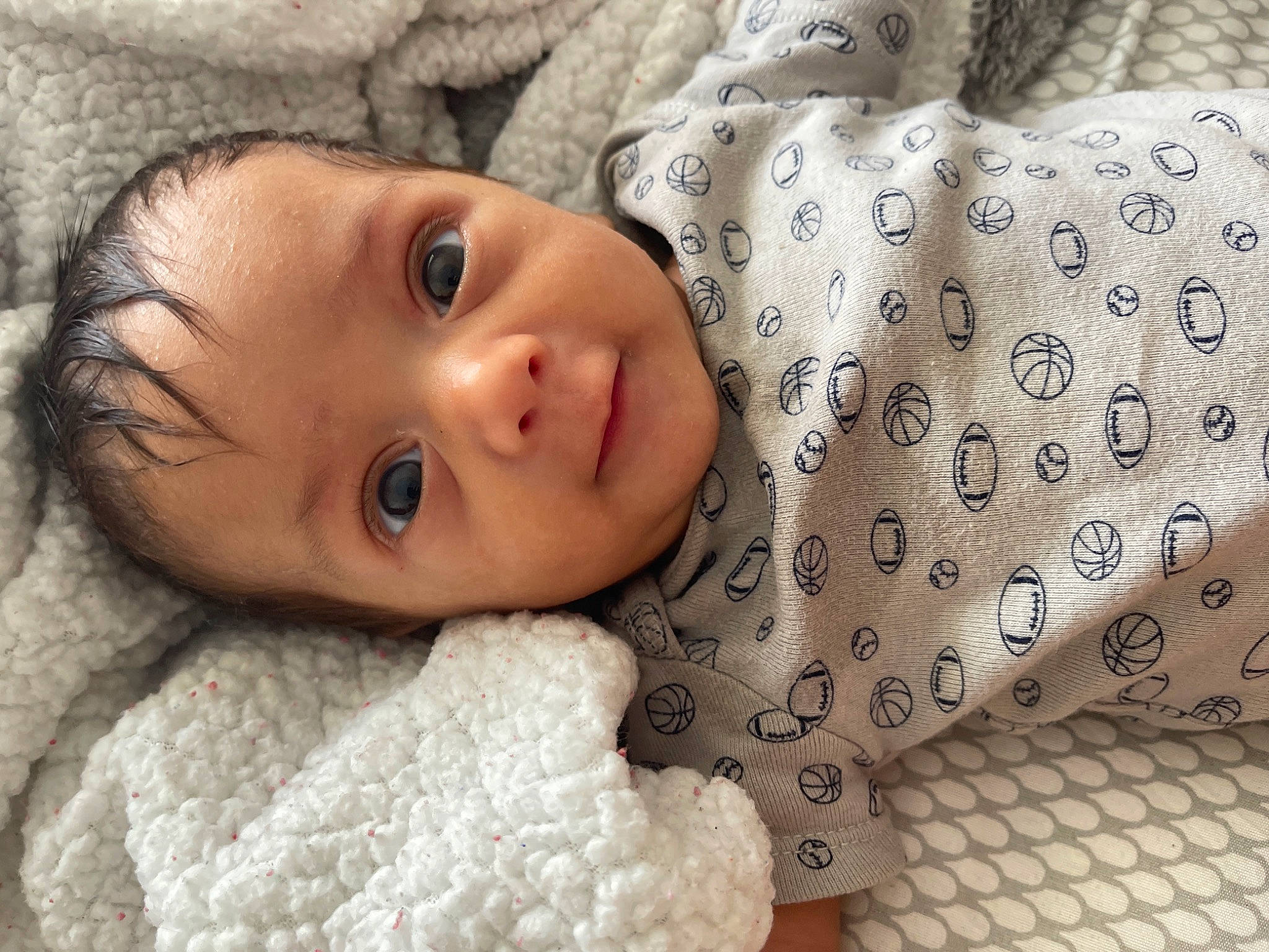 Elijah is registered to the contest to win money with this photo: baby, baby_toddler_clothing, cheek, chin, comfort, eye, eyebrow, eyelash, face, facial_expression, happy, human, iris, lip, mouth, nose, person, skin, sleeve, textile