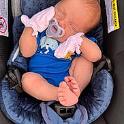 Colton is registered to the contest to win money with this photo: baby, newborn, car_seat, pacifier, mittens, blue_onesie, sleeping, infant, cute, small_feet, child, cozy, resting, head, face, hands, footwear, soft_fabric, safety, childcare