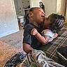 Saniyah joined the competition — help win amazing prizes! affection, bathroom, carpet, child, children, clothing, cute, family, hair, home, hug, indoor, kiss, love, person, playful, sitting, smile, toddler, young