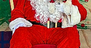 Milo joined the competition — help win amazing prizes! background_painting, beard, black_and_white_dog, boots, carpet, celebration, christmas, costume, decorations, dog, festive, festivity, glasses, holiday, indoor, portrait, red_chair, santa_claus, seated, smile