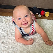 Vince joined the competition — help win amazing prizes! baby, smiling, blue_eyes, infant, crawling, rug, plush_toy, mickey_mouse, toy, floor, wooden_floor, indoor, child, cute, happy, clothing, patterned_outfit, american_flag_pattern, skin, person