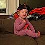 Lahna is registered to the contest to win money with this photo: architecture, baby, baseballcap, bodypart, building, cap, clothing, couch, cushion, face, furniture, hat, head, homedecor, indoors, livingroom, person, photography, portrait, room